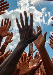 Hands of a group of black people showing their support for each other and to a cause